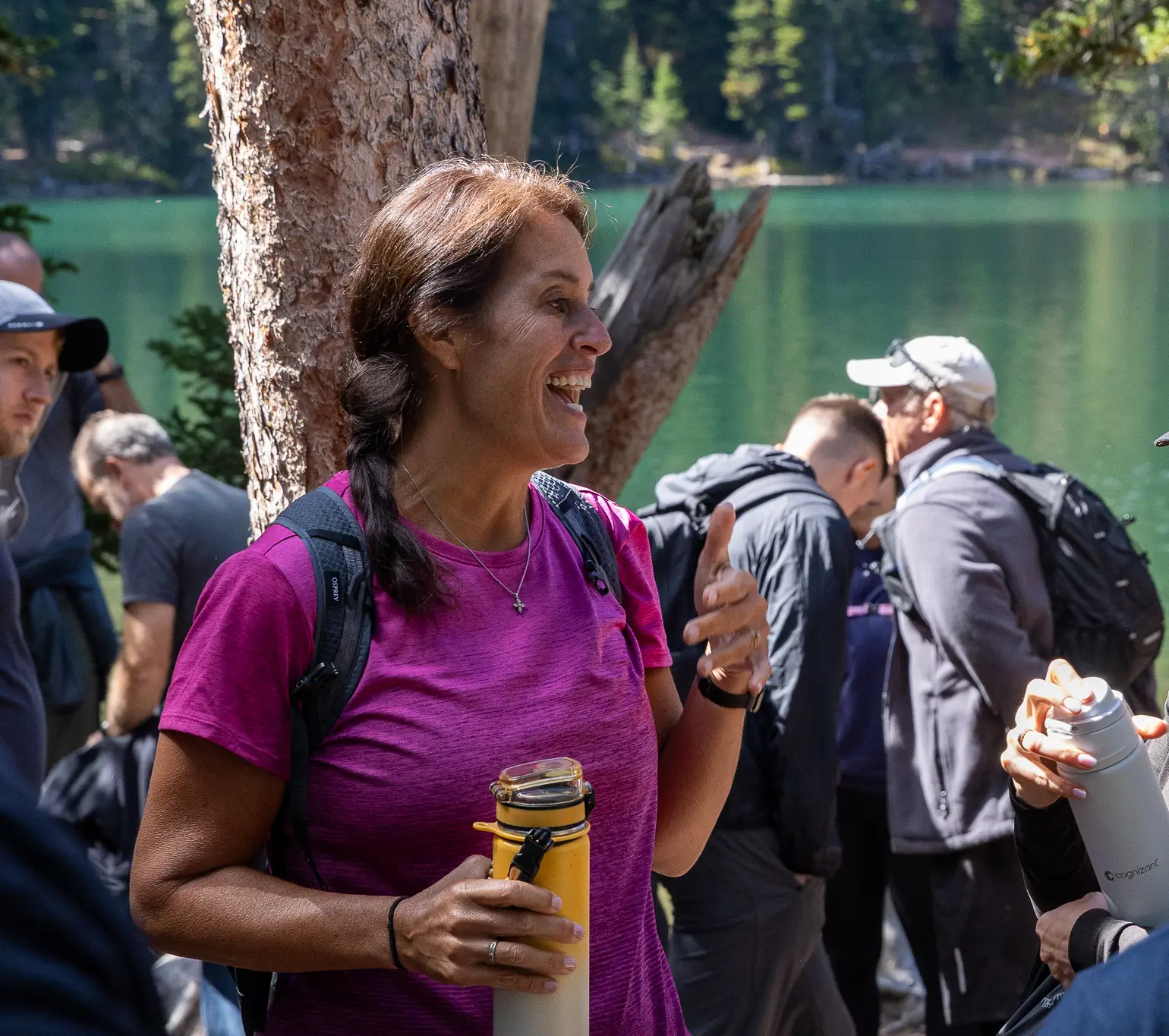 Retreat members laughing together on the shore of Fairy Lake